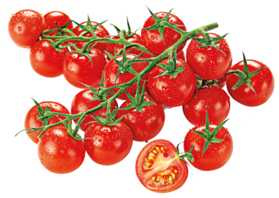 Mehrere Tomaten und im Vordergrund liegt eine halbierte Tomate 
